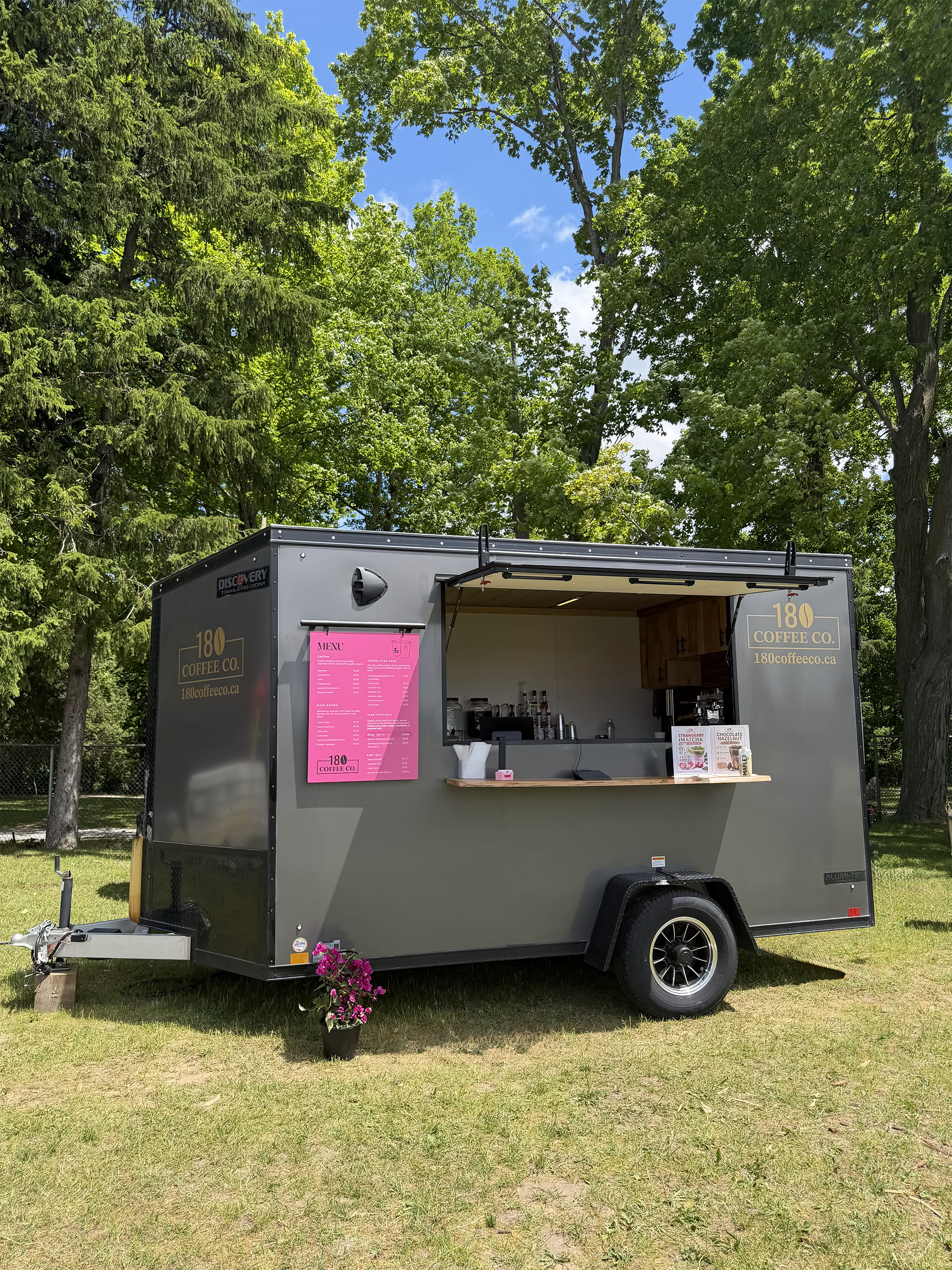 The 180 Coffee Co. trailer parked under the trees